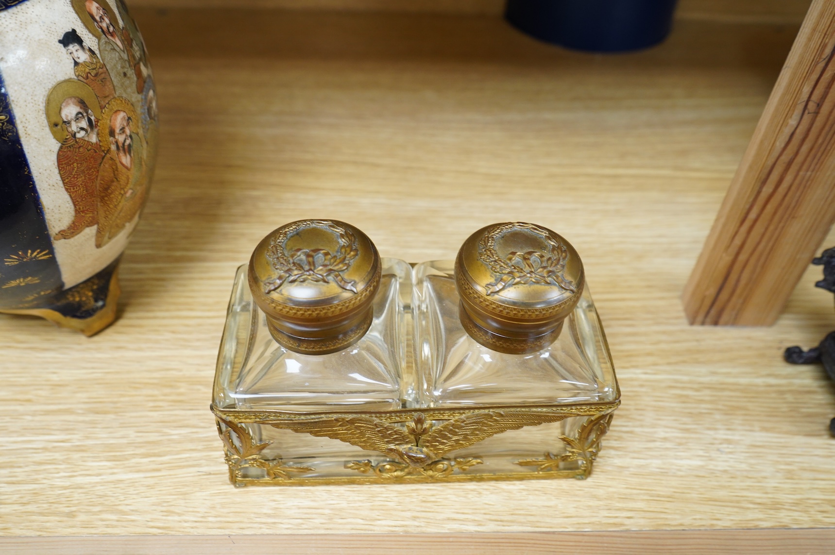 A late 19th/early 20th century French Empire style gilt brass double inkwell, 15cm wide